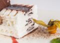 Detail of a viennetta frozen cake dessert with a Physalis.